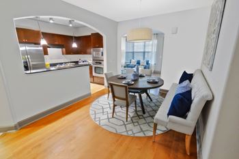 A modern kitchen with a dining table